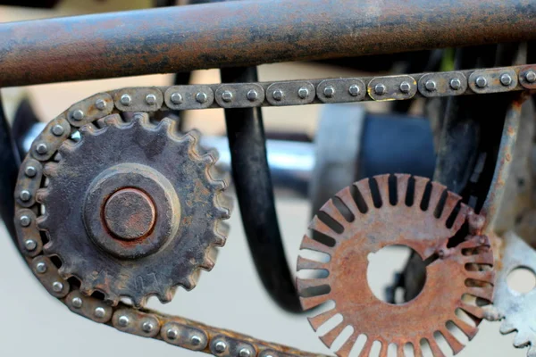 Metal art in the style of steampunk, close-up, gears, pistons, bushings