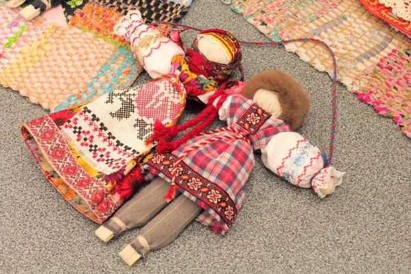 Toys made of fabrics, dolls in folk clothes, the concept of seed relationships, handmade.