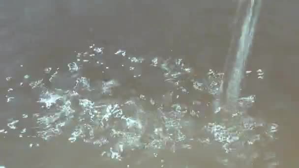 Stream Water Pours Surface Reservoir Close Sun Glare Scatter Surface — Stock video