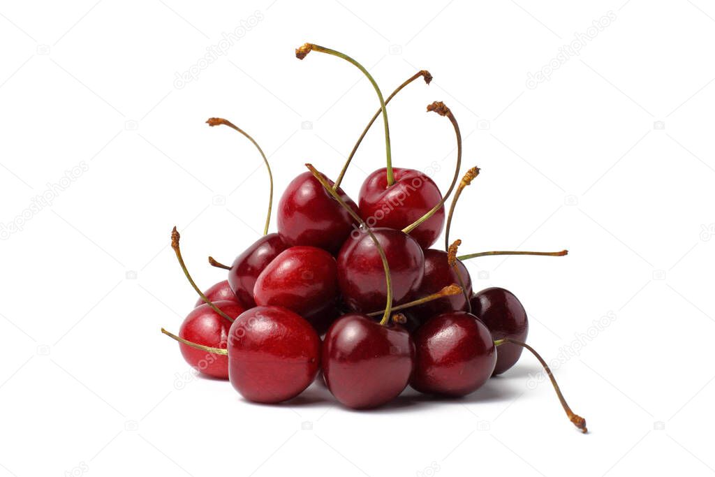 Pyramid of sweet cherry berries with sprigs on a white background, isolate, close-up. Place for text, copy space. 