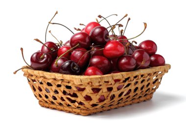 Hasır sepetteki tatlı organik kiraz meyveleri, beyaz arka plan, yakın plan..