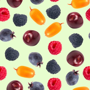 Açık yeşil, farklı ve çok renkli tatlı orman meyveleri üzerinde kusursuz desen, üst manzara, düz yatış.