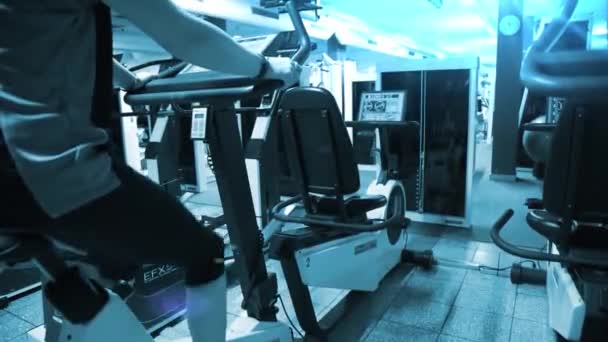 Girl Exercising Stationary Bike Gym — Stock Video