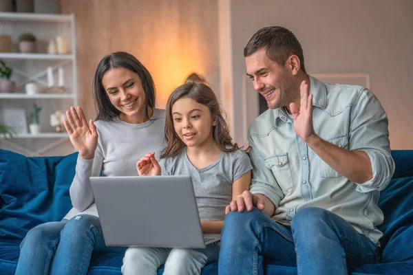 Happy family waving hands looking at web camera using laptop for — Stock Photo, Image