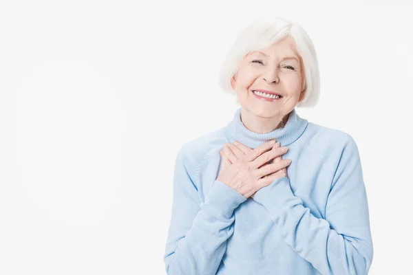 Thankful Mature Smiling Woman Hold Hands Chest Feel Appreciation Isolated — Stock Photo, Image