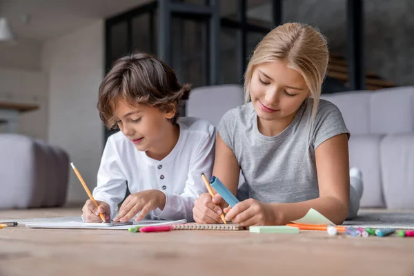 Two School Age Kids Doing Homework Floor Home — Stock Photo, Image