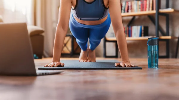 Cropped Shot Young Woman Watching Training Videos Laptop While Exercising Royalty Free Stock Photos