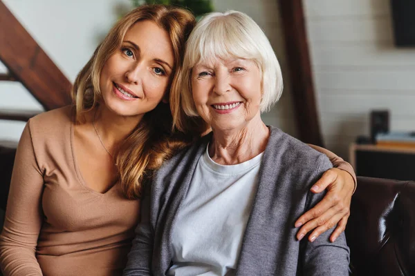 Close Portrait Elderly Mother Middle Aged Daughter Smiling Together Couch Royalty Free Stock Images