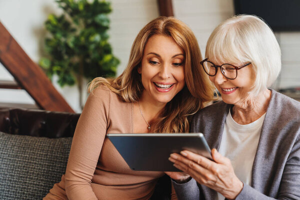 Positive Senior Woman Her Daughter Using Tablet Home Stock Image