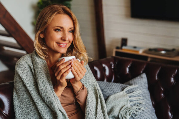 Close Dreaming Middle Aged Woman Sitting Living Room Cup Coffee Royalty Free Stock Photos