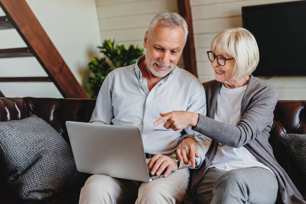 Mature Man Woman Using Laptop Together Looking Screen Sitting Sofa Stock Picture