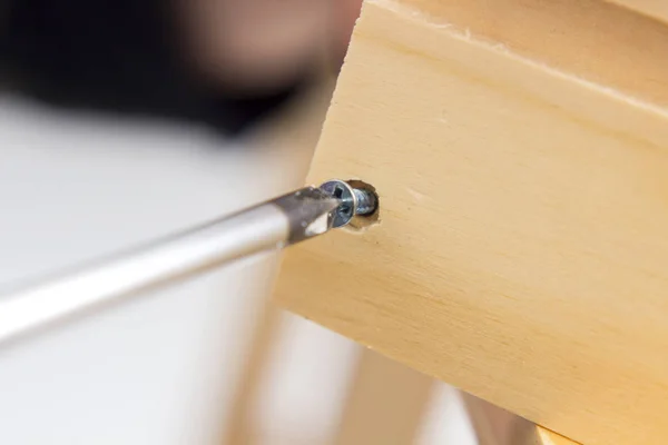 Carpenter Using Screwdriver Tool While Repairing Wardrobe Cabinet Fixing Concept — Stock Photo, Image