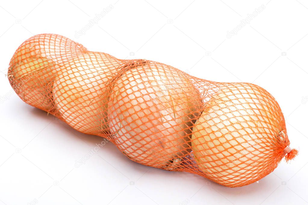 Fresh raw onions in vegetable net