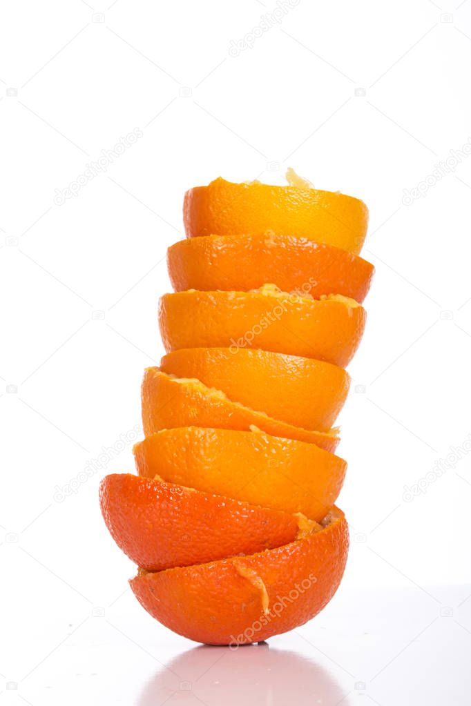 squeezed orange peel skins isolated on white