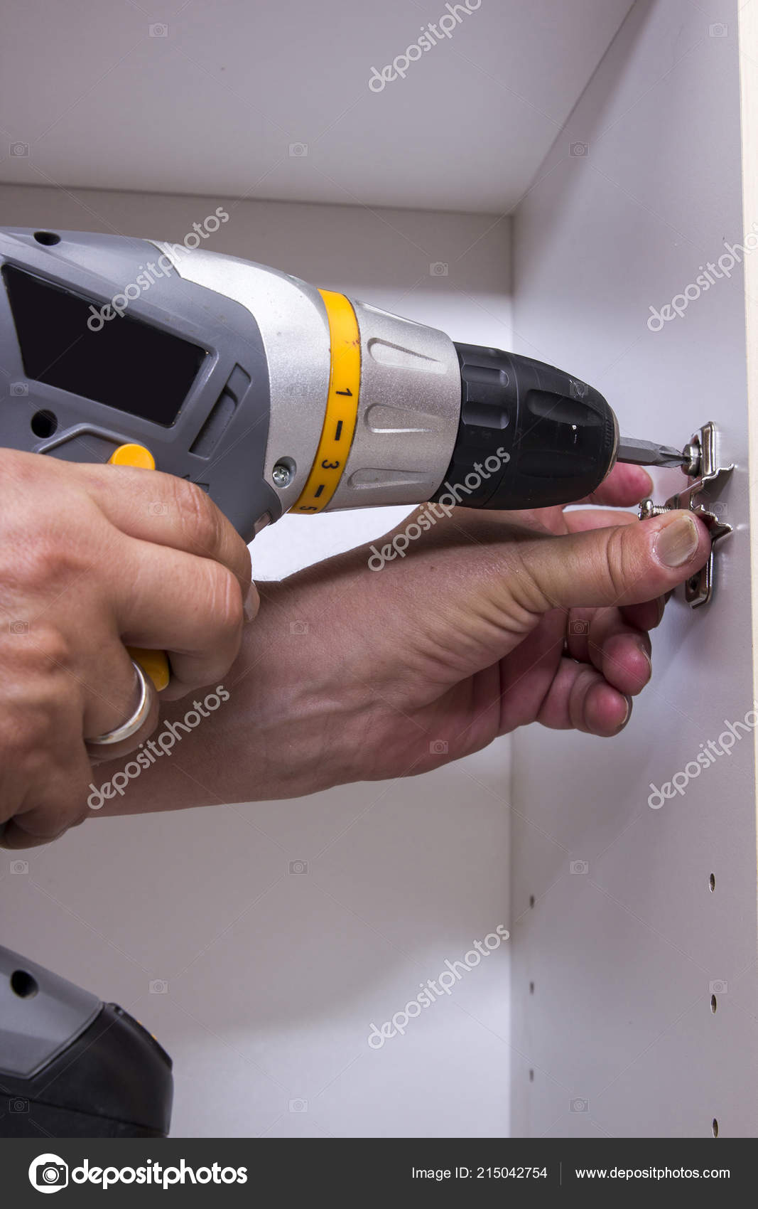 Man Working Screwdriver Fixing Wooden Closet Door Hinge Stock