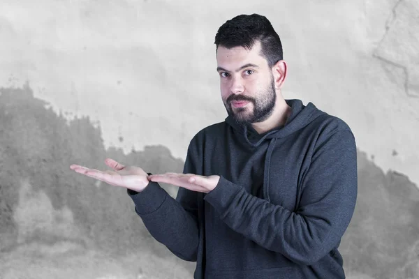 caucasian man with stubble showing left side for copy space