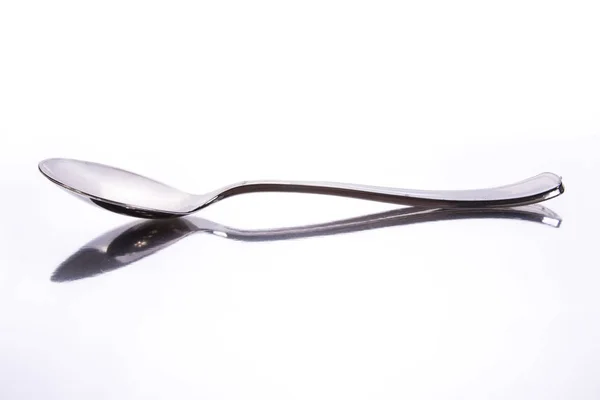 Metallic Spoon White Surface Reflection — Stock Photo, Image