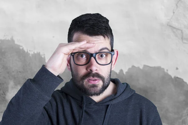 portrait of amazed man wearing glasses