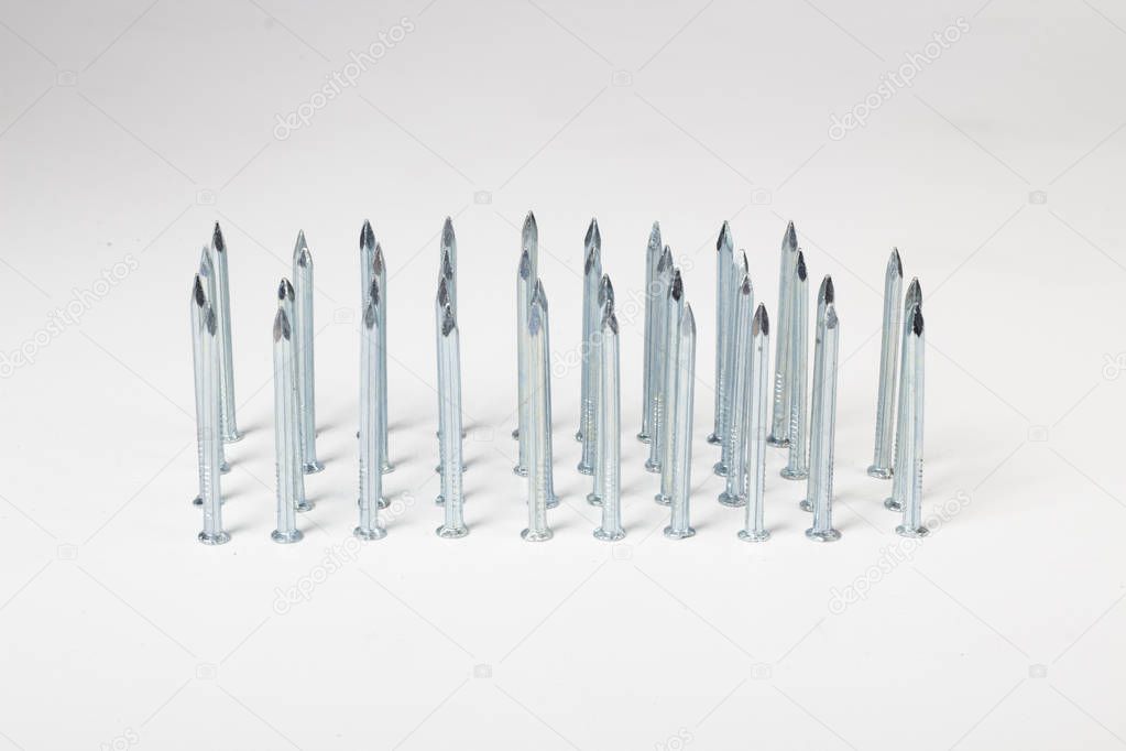 metallic Steel spikes pins isolated on white 