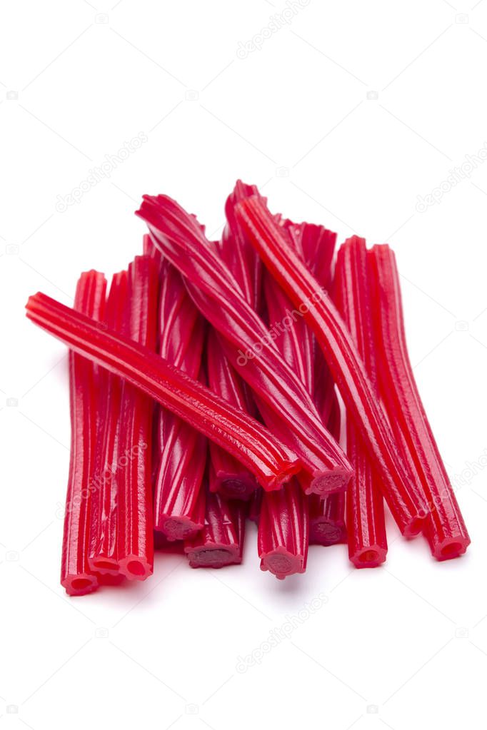 red licorice candies isolated on white in studio, copy space
