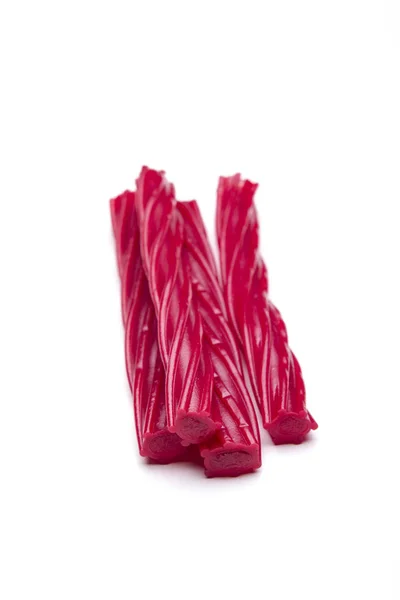 Bâtonnets Rouges Sucrés Gommeux Isolés Sur Des Bonbons Dessert Blancs — Photo