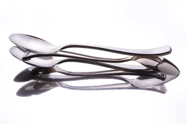 Stainless Steel Spoons Glassy Surface Reflection Studio Shot — Stock Photo, Image