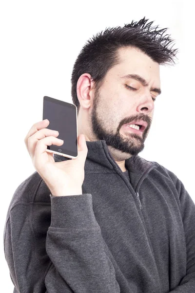 Escéptico Hombre Caucásico Utilizando Teléfono Móvil Haciendo Cara Divertida —  Fotos de Stock