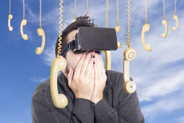 scared man wearing VR glasses