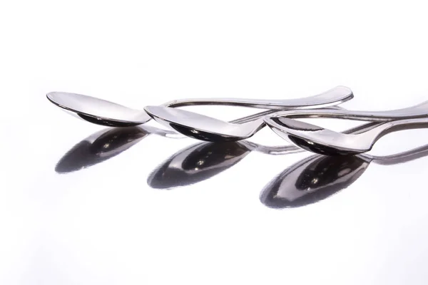 Stainless Steel Spoons Glassy Surface Reflection Studio Shot — Stock Photo, Image