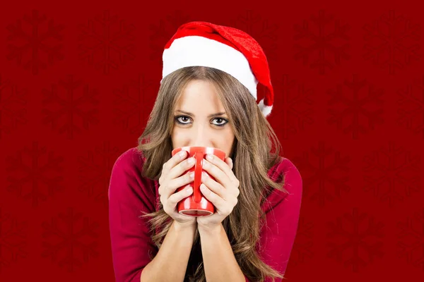 Woman Red Santa Hat Drinking Coffee Studio Red Background — Stock Photo, Image