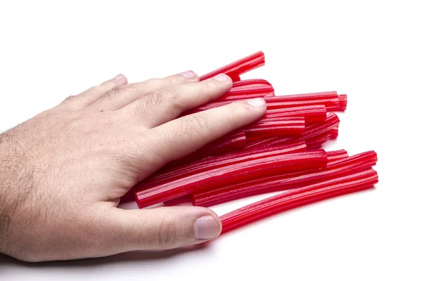 Visão Parcial Mão Masculina Tocando Palitos Alcaçuz Vermelho — Fotografia de Stock