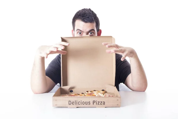 caucasian man with pizza box in studio, man opening box and looking at camera