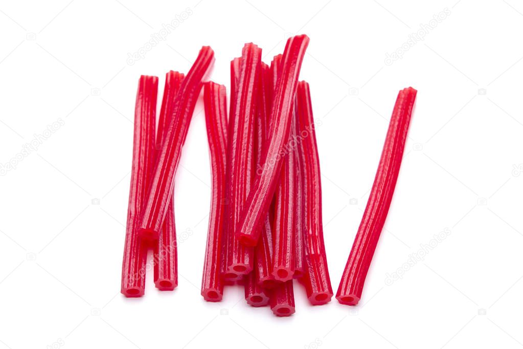 gummy sugary red sticks isolated on white, sweet dessert candies 