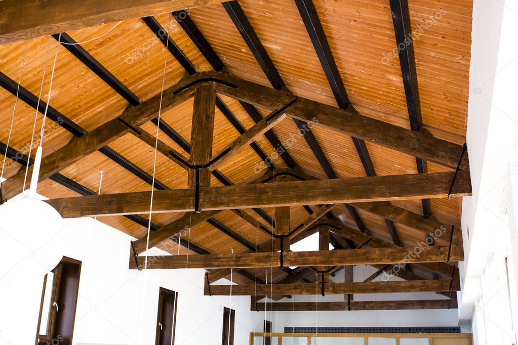 Inside view of wooden roof with white light-bulbs
