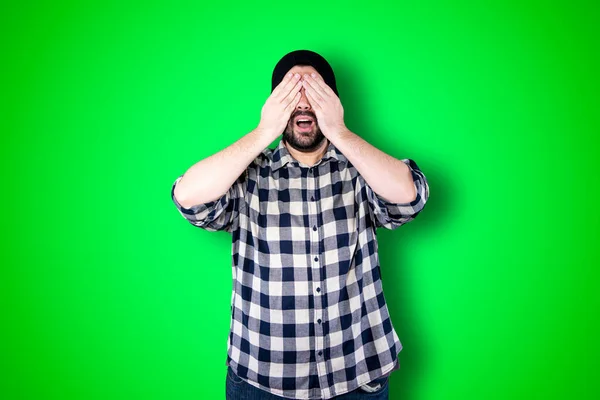 I\'m afraid. Fright. Portrait of the scared man. Business man standing isolated on trendy green studio background. Male half-length portrait. Human emotions, facial expression concept