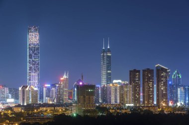 Skyline of Shenzhen City, China at twilight. Viewed from Hong Ko clipart