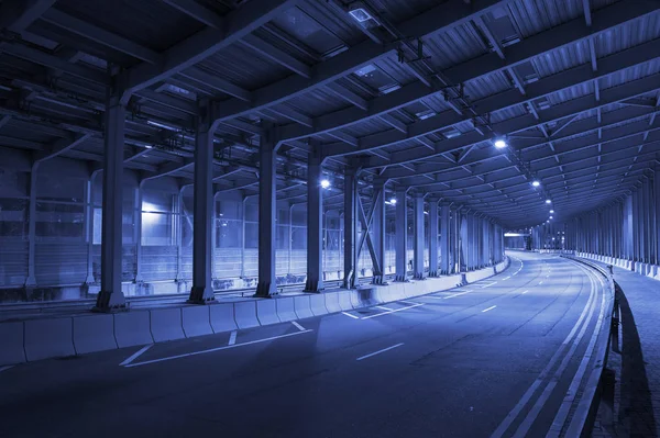 stock image Urban city, footbridge and buildings at night