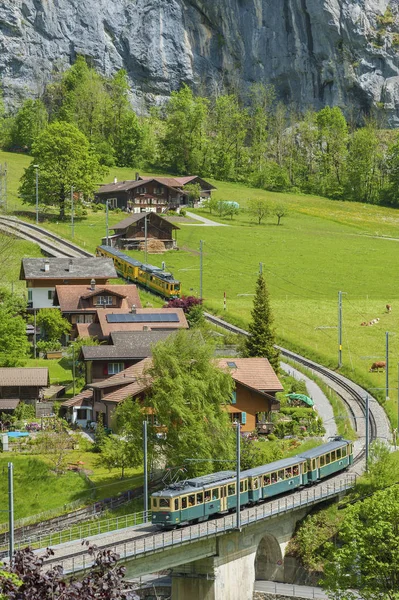 Train in Lauterbrunnen valley, Switzerland. Idyllic landscape of Swiss