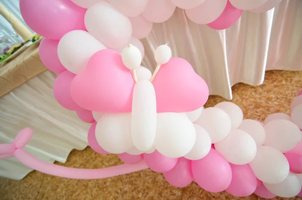White and pink balloons in the form of a butterfly. Wedding Day Decoration.