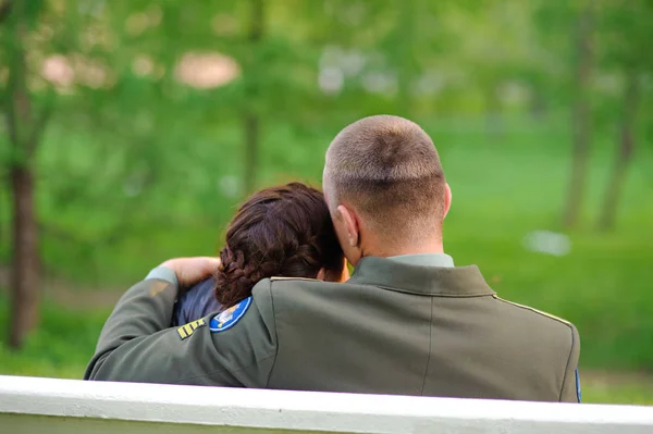 Young Couple Girl Guy Military Uniform Hugging Sitting Bench Park — Stock Photo, Image