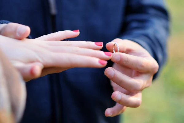 Close Male Hand Puts Gold Engagement Ring Finger Female Hand — Stock Photo, Image