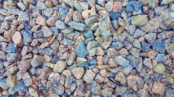 Texture: small sanded gravel. Small white, grey and blue chalk stones. Artistic reliefs from natural objects. Material for construction work and the manufacture of concrete structures. — Stock Photo, Image
