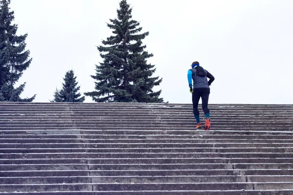 Man runs up the stairs