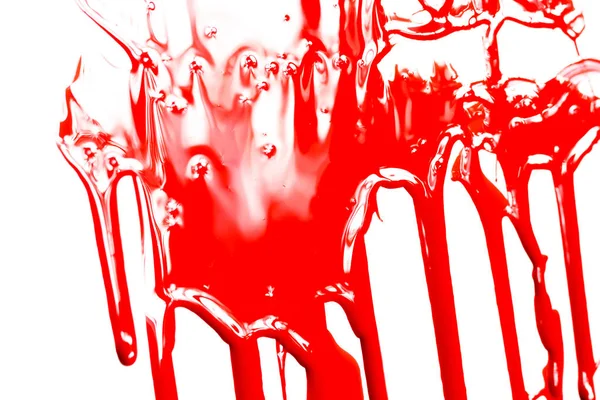 Tinta vermelha sobre um fundo branco — Fotografia de Stock
