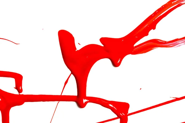 Червона фарба крупним планом на білому тлі — стокове фото