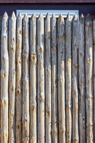 Fence from trunks of trees — Stock Photo, Image