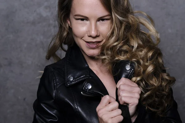 Stunning Playful Blonde Model Leather Jacket Stock Image