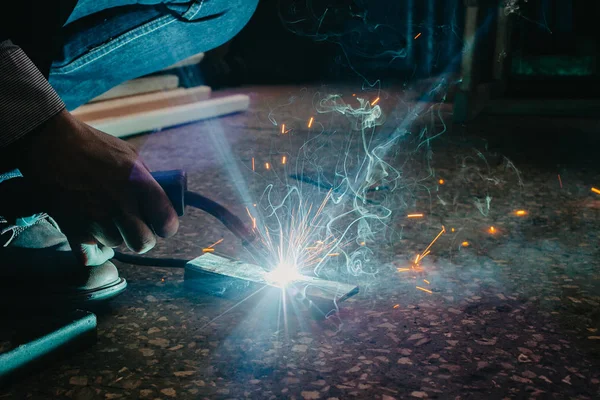 bright sparks from semi-automatic welding