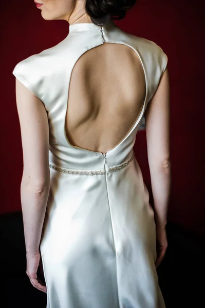 Elegant white wedding dress, large neckline on the back