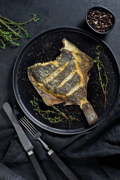 Grilled plaice, balanced healthy food. Gray background, top view, space for text.